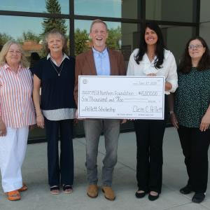 Representatives from Montana State University-Northern’s Foundation proudly accept a symbolic check for the first proceeds from the book. Pictured (L to R) Arleen Rice, Chair; Marla Shulund, Director of Operations; Clem C. Pellett, Author; Melanie Skoyen, Managing Director; Toni Pedersen, Director of Finance.