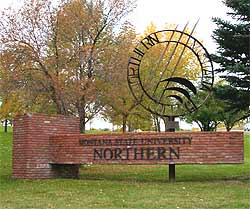 Raised curved brick planter with welded NMC symbol